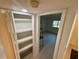 Bright pantry with shelving for optimal storage and organization in the house at 721 83Rd N Ave # 108, St Petersburg, FL 33702