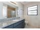 Bright bathroom featuring a granite vanity and a shower and tub combination at 1117 Mook St, Brandon, FL 33510