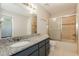 Bathroom featuring a granite vanity, ample lighting, and shower/tub combo at 1117 Mook St, Brandon, FL 33510