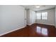 Cozy bedroom with a ceiling fan and a window overlooking the yard at 1117 Mook St, Brandon, FL 33510