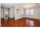 Bright dining room with hardwood floors, classic lighting, and view into other rooms at 1117 Mook St, Brandon, FL 33510