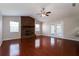 Spacious living room features a brick fireplace, vaulted ceilings, wood floors, and natural light at 1117 Mook St, Brandon, FL 33510