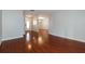 Bright hallway with hardwood floors offering views to dining room, living areas, and front door at 1117 Mook St, Brandon, FL 33510