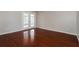 Bright room with rich wood flooring and french doors leading to the outside at 1117 Mook St, Brandon, FL 33510