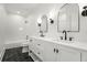 Charming bathroom with a double vanity, tub, shower, and black and white flooring at 4115 N Central Ave, Tampa, FL 33603
