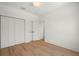Spacious bedroom featuring wood flooring, a ceiling light, and a closet at 4115 N Central Ave, Tampa, FL 33603