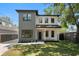 Charming two-story home with light gray and white exterior paint and black trim at 4115 N Central Ave, Tampa, FL 33603