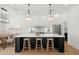 Bright kitchen featuring a large island, modern pendant lighting, and stainless steel appliances at 4115 N Central Ave, Tampa, FL 33603