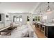 Open-concept living space with modern kitchen island and stylish furnishings at 4115 N Central Ave, Tampa, FL 33603