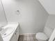 Cozy bathroom featuring a vanity with sink, toilet, and a large mirror at 6902 Lakeview Ct, Tampa, FL 33634