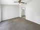 Spacious bedroom features neutral carpet, ceiling fan and ample closet space at 6902 Lakeview Ct, Tampa, FL 33634