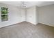 Bright and spacious bedroom featuring neutral carpet, a ceiling fan, and ample closet space at 6902 Lakeview Ct, Tampa, FL 33634