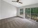 Bedroom with neutral carpet, sliding glass door to balcony and great natural light at 6902 Lakeview Ct, Tampa, FL 33634