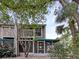 Charming two-story home with a screened-in lanai and mature landscaping at 6902 Lakeview Ct, Tampa, FL 33634