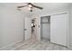 Bright bedroom features tile floors, neutral walls, a ceiling fan and closet at 75 Virginia Ct, Englewood, FL 34223