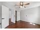 Bright bedroom with hardwood floors and direct access to both the closet and en suite bathroom at 75 Virginia Ct, Englewood, FL 34223