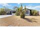 Well-maintained home with tropical landscaping, a spacious driveway, and a welcoming facade at 75 Virginia Ct, Englewood, FL 34223