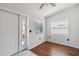 Inviting entryway with hardwood floors, natural light, and a modern front door, creating a warm welcome at 75 Virginia Ct, Englewood, FL 34223