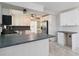 Open kitchen featuring ample counter space, stainless steel appliances, and bright cabinetry at 75 Virginia Ct, Englewood, FL 34223