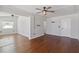 Spacious living room featuring beautiful hardwood floors and modern ceiling fans for comfort at 75 Virginia Ct, Englewood, FL 34223