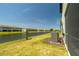 Enjoy the serene water view from this backyard space with an outdoor AC unit and lush grass at 15242 Sunny Day Dr, Bradenton, FL 34211