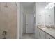 Neutral bathroom with tiled walk-in shower and vanity with granite counters at 15242 Sunny Day Dr, Bradenton, FL 34211