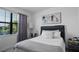 Bedroom features window views, neutral décor, and a decorative headboard at 15242 Sunny Day Dr, Bradenton, FL 34211