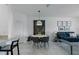 Stylish dining area with modern furnishings and decor is conveniently located next to the living room at 15242 Sunny Day Dr, Bradenton, FL 34211