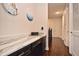 Hallway desk featuring marble countertop and views of the hall with hardwood floors at 1966 Hyde Park St, Sarasota, FL 34239