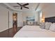 Spacious main bedroom features dark wood floors and a tray ceiling with recessed lighting at 1966 Hyde Park St, Sarasota, FL 34239