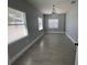 Spacious bedroom featuring tile floors, light gray walls, and lots of sunlight shining through the bright windows at 3735 Alabama Ne Ave, St Petersburg, FL 33703
