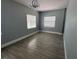 A beautifully designed bedroom offering ample space, natural lighting, and decorative chandelier at 3735 Alabama Ne Ave, St Petersburg, FL 33703