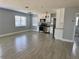Open-concept kitchen featuring stainless steel appliances, white cabinets, and granite countertops at 3735 Alabama Ne Ave, St Petersburg, FL 33703
