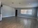 Bright living room with large windows and modern flooring at 3735 Alabama Ne Ave, St Petersburg, FL 33703
