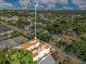 Aerial perspective highlights the townhome property lines, townhome roofs, lush trees, and street access at 4409 W Gray St # 5, Tampa, FL 33609