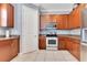 Well-equipped kitchen featuring stainless steel appliances, wood cabinets, and granite countertops at 4409 W Gray St # 5, Tampa, FL 33609