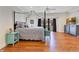Main bedroom with wood floors, and access to the balcony at 4409 W Gray St # 5, Tampa, FL 33609