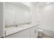 Bright bathroom with double vanity, granite countertop and tiled shower-tub combo at 7740 Gilchrist Springs Dr, Parrish, FL 34219