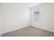 Cozy bedroom illuminated by a window with blinds and neutral carpet at 7740 Gilchrist Springs Dr, Parrish, FL 34219