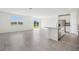 Bright living space with island and stainless steel appliances overlooks backyard pond at 7740 Gilchrist Springs Dr, Parrish, FL 34219