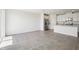 Open-concept living and kitchen area features tile flooring and stainless steel appliances at 7740 Gilchrist Springs Dr, Parrish, FL 34219