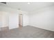Spacious main bedroom featuring a carpeted floor and an ensuite bathroom at 7740 Gilchrist Springs Dr, Parrish, FL 34219