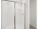Bathroom with a glass-enclosed shower and tile surround at 7740 Gilchrist Springs Dr, Parrish, FL 34219