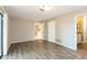 Bedroom featuring hardwood floors, neutral paint, and doors leading to other rooms at 12408 Golden Oak Cir, Hudson, FL 34669