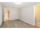 Bright bedroom with neutral paint, wood floors, and ample closet space at 12408 Golden Oak Cir, Hudson, FL 34669