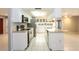 Clean kitchen features stainless steel appliances, ample counter space, and tiled floors at 12408 Golden Oak Cir, Hudson, FL 34669