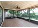 Spacious screened porch with tile flooring and view of the backyard, perfect for outdoor relaxation at 12408 Golden Oak Cir, Hudson, FL 34669