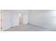 Bright and spacious bedroom with carpeting, two entry doors, and access to a walk-in closet at 42858 Park View Dr, Punta Gorda, FL 33982