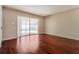 Bright bedroom with wood floors, and view of pool area at 8506 Moulton Dr, Port Richey, FL 34668
