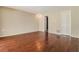 Bedroom with wood floors, closet and bathroom access at 8506 Moulton Dr, Port Richey, FL 34668